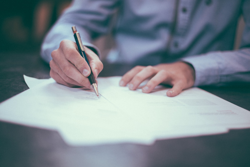 Man signing contract